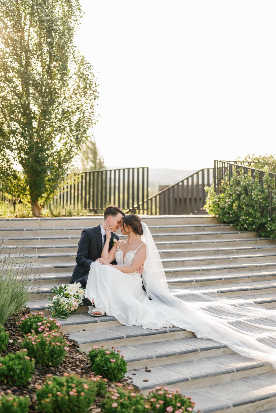 A couple sitting together on garden steps