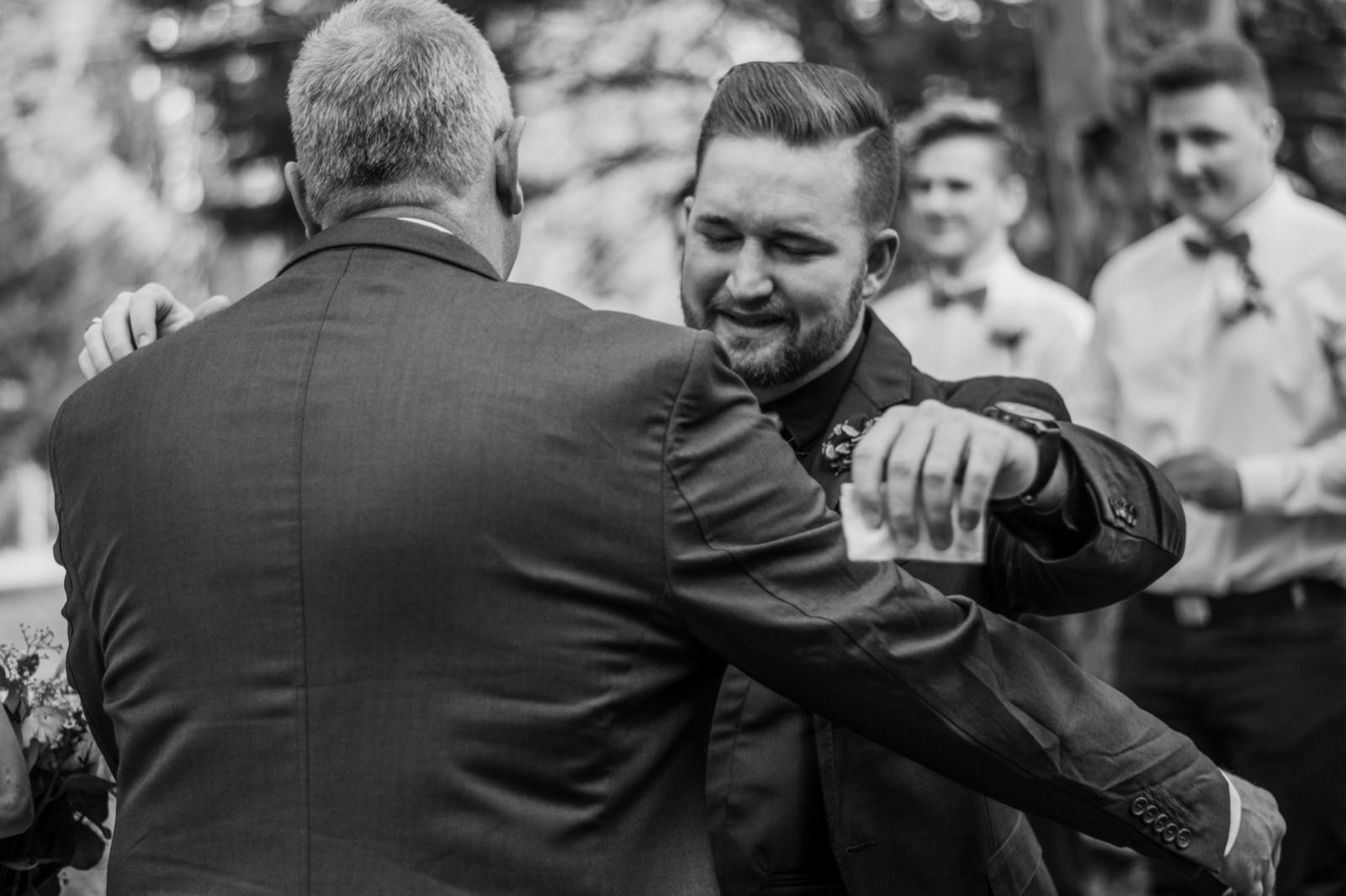 Groom dancing with a loved one at the reception