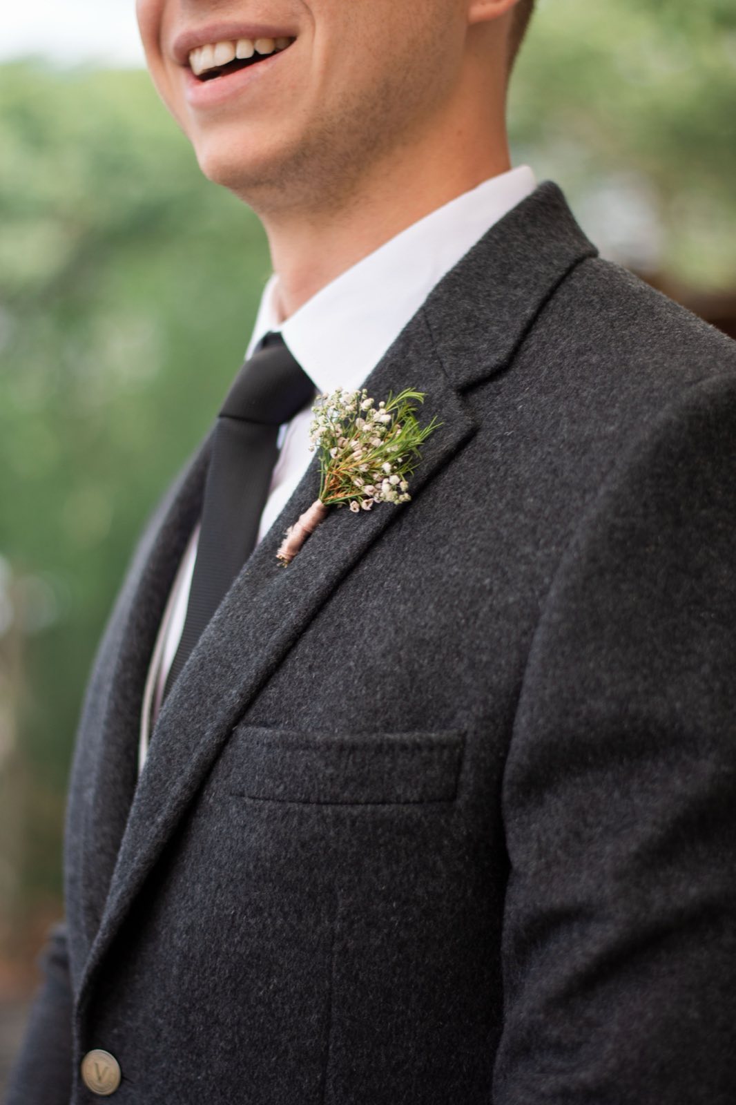 Close portrait of a groom wearing a boutonniere