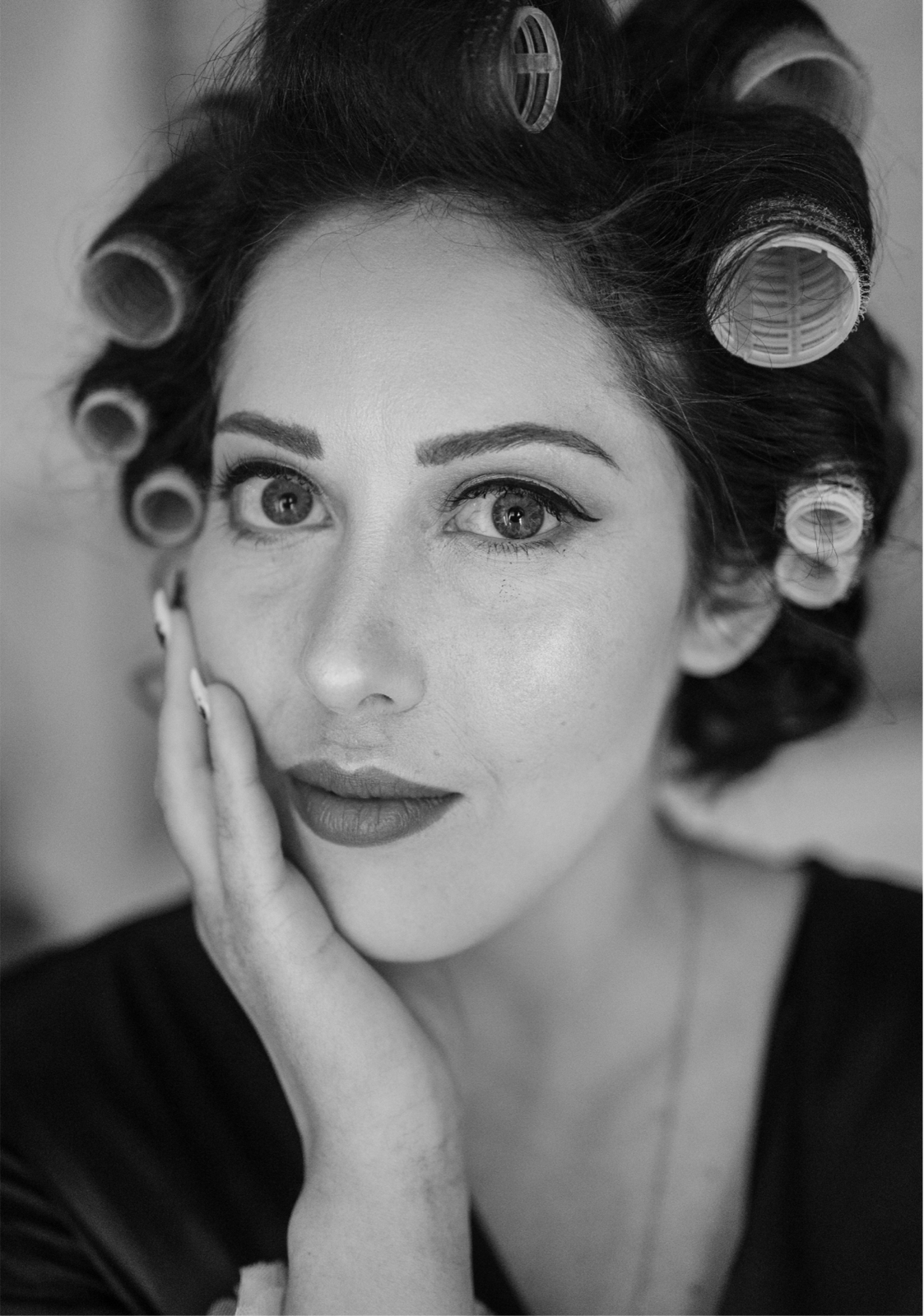 Black and white bridal portrait with hair rollers